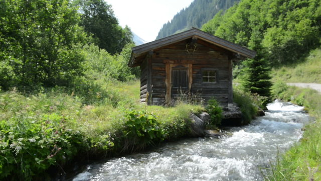 Little alpine Hovel at stream water at Zillertal