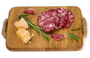 salami slices, parmesan cheese and rosemary isolated on white
