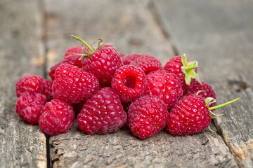raspberries on wooden surface