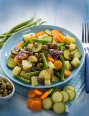 steamed mixed vegetables with capers, selective focus