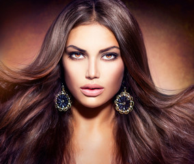 Glamour Beautiful Woman with Blowing Brown Hair