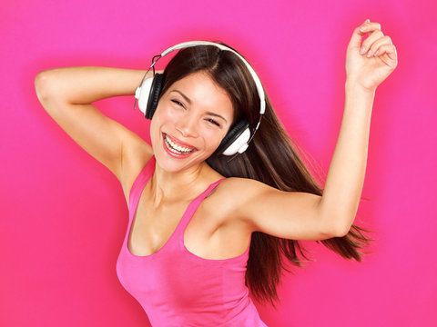 Music - woman wearing headphones dancing