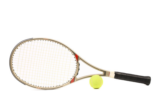 Gray tennis racket and yellow ball