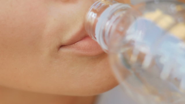 close-up of a girl who drinks water