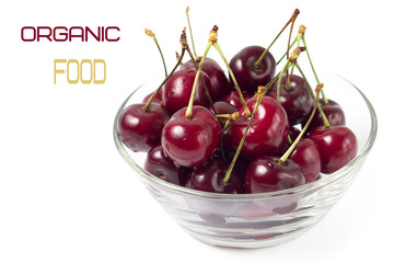 Fresh Cherry in glass bowl isolated on white