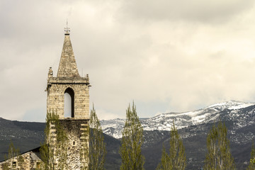 Church with the Pyrenees