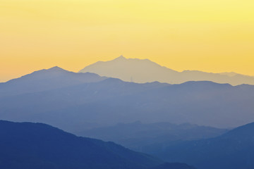 Fototapeta premium Foggy sunset on the mountains