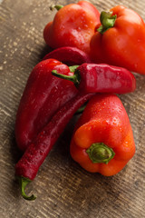 Fresh peppers on wooden table