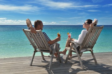 happy young couple relax and take fresh drink