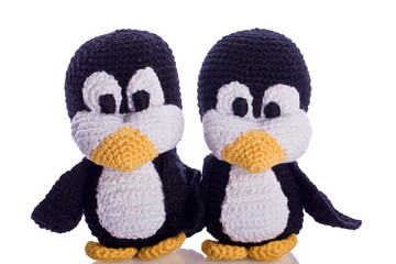 couple of black and white penguin stuffed animal