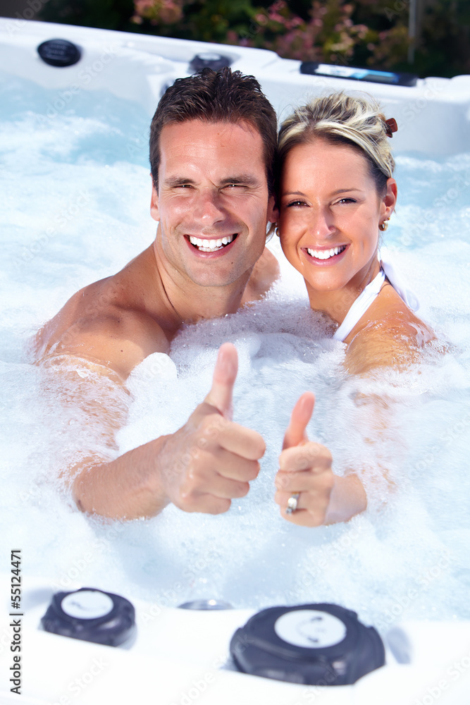 Wall mural Happy couple in hot tub