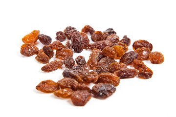 brown raisins on a white background