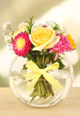 Beautiful bouquet of bright flowers in glass vase,