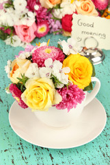 Beautiful bouquet of bright flowers in color vase,