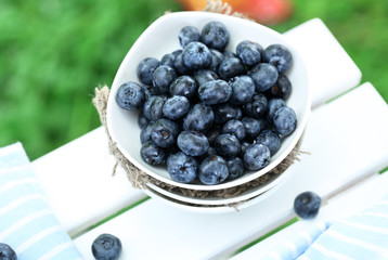Blueberries in plates near napkin