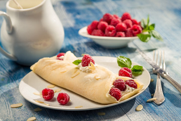 Pancakes with raspberry and cream