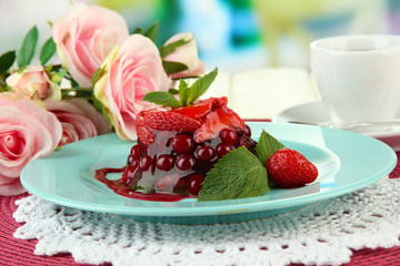 Tasty jelly dessert with fresh berries, on bright background