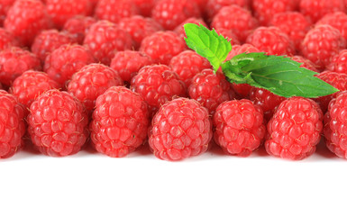 Ripe sweet raspberries isolated on white