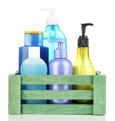 Wooden box with cosmetic products isolated on white