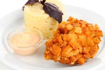 Chicken Kiev  and mashed potatoes on plate, isolated on white