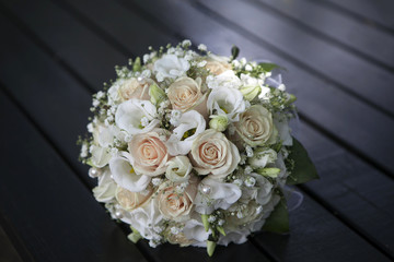 Wedding bouquet of yellow and cream roses