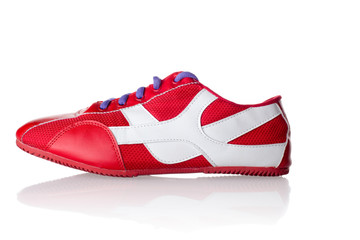 Red athletic sneaker with purple laces