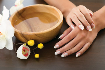 Woman's hands lying on the table