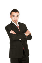 Handsome young business man standing with folded arms