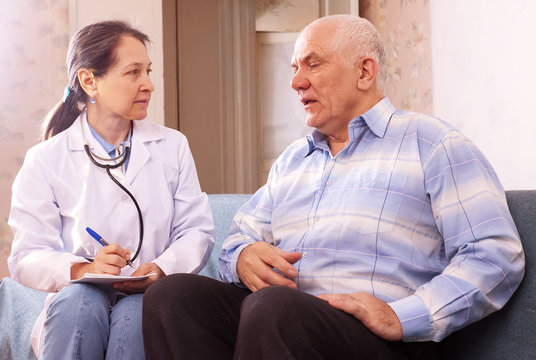 mature man complaining to doctor about feels