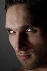 Obraz premium Portrait of sexy dark man posing in studio