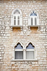 Fototapeta na wymiar Venetian gothic window on old house , Croatia