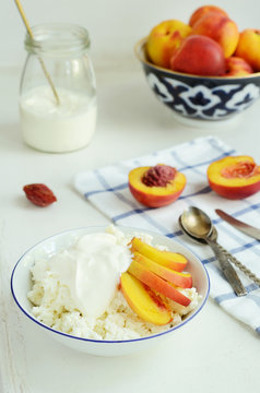 Breakfast with cottage cheese, fresh nectarines and sour cream