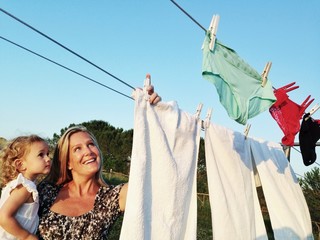 Mother and child hanging linen