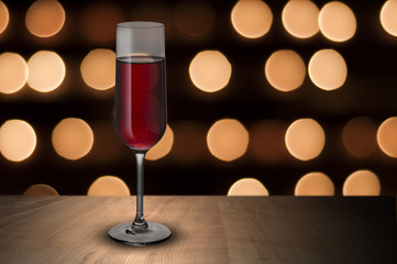 Glass of red wine on wood table