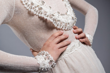 Detail of white knitted dress