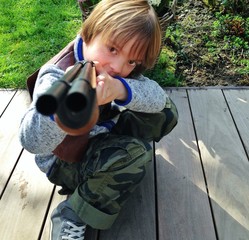 boy playing with gun