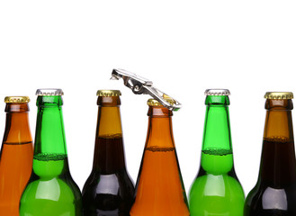 Top bottles of beer and a opener.