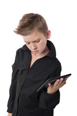 Boy holding tablet isolated on white.