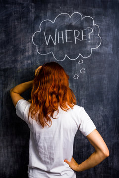 Frustrated redhead woman asking where