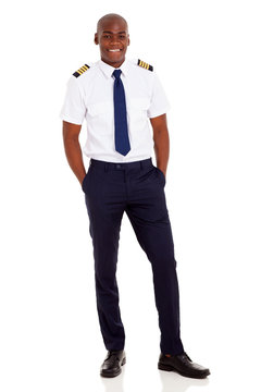 African Airline Pilot Standing Over White Background