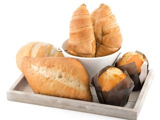 Bread,muffins and croissant on white background