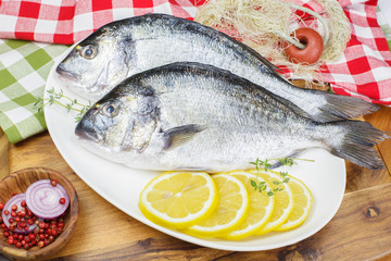 Fresh dorado fish with thyme and lemon