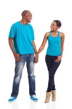 young african couple standing on white background