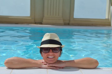 Happy woman in swimming pool