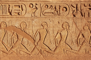 Ancient hieroglyphics on the wall of Great temple of Abu Simbel,