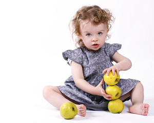 Fototapeta premium Little girl with apples