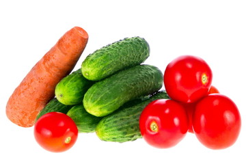 ripe tomatoes cucumbers and carrots on a white background