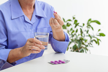 Woman taking pills