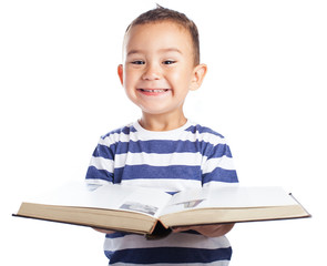 Child holding a open book on white background