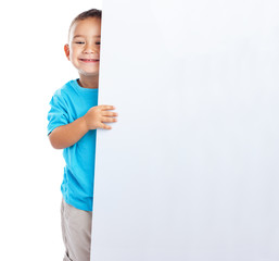 cheerful child hidden behind a white banner